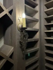 Old world wrought iron candle sconce reclaimed barnwood wine cellar Aldie Virginia